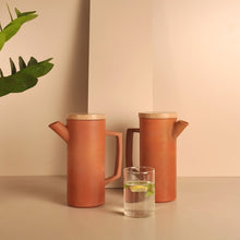 Load image into Gallery viewer, Set of 2 - Minimal, Sleek &amp; contemporary HandmadeTerracotta earthen Jug/Clay Pitcher for your Home/Office/Dinning and Table top - Double fired from Earthen collection - 1000ml/1 litre with Wooden lid-Terracotta-Claymango.com
