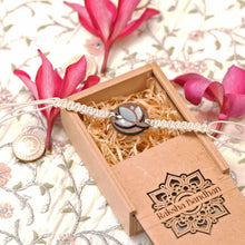 Load image into Gallery viewer, Neerja-Handcrafted Wooden &amp; Mother-of-Pearl Rakhis with Silk yarn braiding– A Celebration of Design and Tradition
