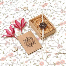Load image into Gallery viewer, Ruhira-Handcrafted Wooden &amp; Mother-of-Pearl Rakhis with Silk yarn braiding – A Celebration of Design and Tradition
