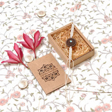 Load image into Gallery viewer, Taru(Emerald)-Handcrafted Wooden &amp; Mother-of-Pearl Rakhis with Silk yarn braiding – A Celebration of Design and Tradition
