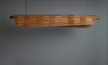 Load image into Gallery viewer, Wooden panel with a checkered pattern on a gray background
